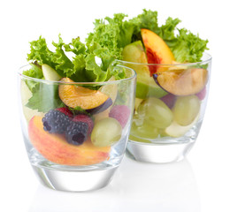 Fruit salad in glasses, isolated on white