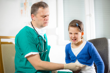 Doctor with little girl