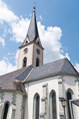 Fototapeta na wymiar church spire against the cloudy sky Gmünd in Kärnten (Carinthia)