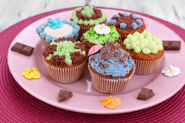 Tasty cupcakes with butter cream,