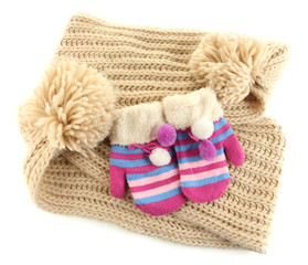 Fototapeta na wymiar Striped mittens with scarf isolated on white