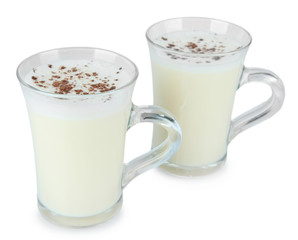 Cups of eggnog isolated on white