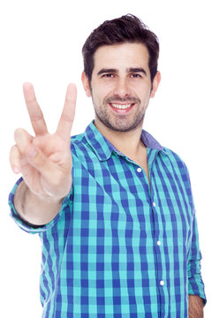Handsome man giving the victory sign, isolated on white backgrou