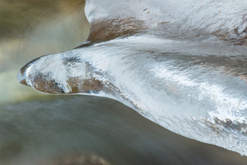River with icicles in winter