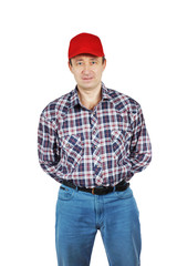 Adult man wearing jeans and a plaid shirt with red cap