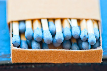 matchbox with blue heads closeup