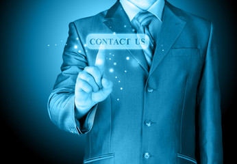 Businessman pushing CONTACT US sign