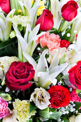 Beautiful rose, carnation and lilly with water drops.