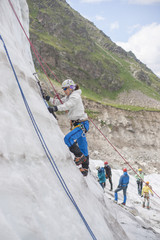 Girl climb up on the ice