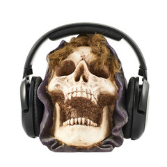 Headphones put on a ceramic skull head