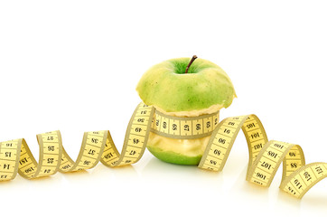 measuring tape and apple
