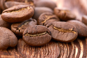 Coffee beans on wood background