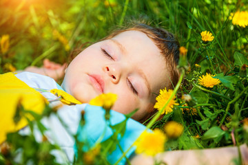 Sleeping boy on grass