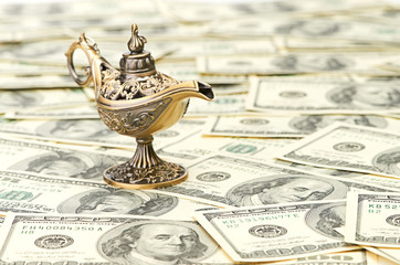 aladdin lamp on dollar background