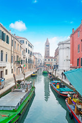 Venice canal under a blue sky