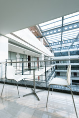 Modern buildings, the corridor, the simplicity of the chair