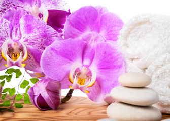 Fototapeta na wymiar Spa still life with stone, orchid and towel