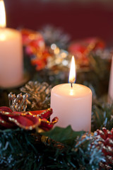 Obraz na płótnie Canvas Advent wreath with burning candles for the pre Christmas time
