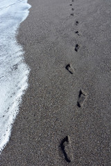 Fototapeta na wymiar Footprints at the sand