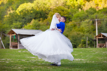 Newly married couple dancing outdoor