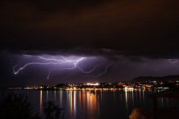 Fototapeta na wymiar Lightning over the seaside