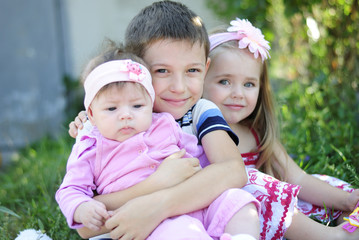 three kids near colors