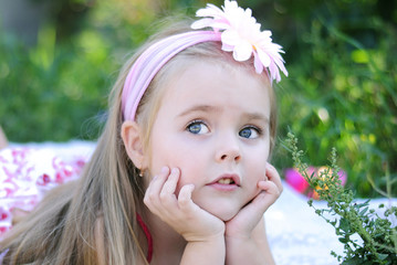 pretty little girl on green grass