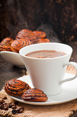 Cup of coffee and biscuits with poppy seeds