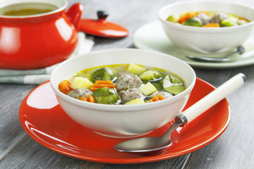 Soup with meatballs and brussels sprouts