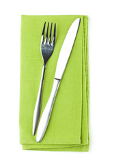 Silverware or flatware set of fork and knife on towel