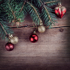 Christmas green fir tree with toys on a wooden board