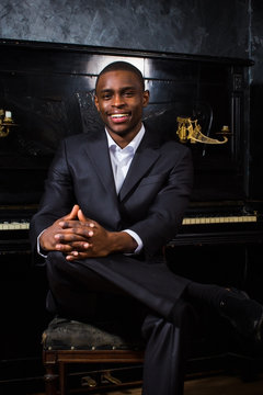 Black man near the piano