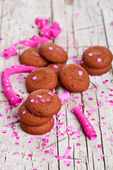 fresh chocolate cookies, coffee beans, pink ribbons and confetti