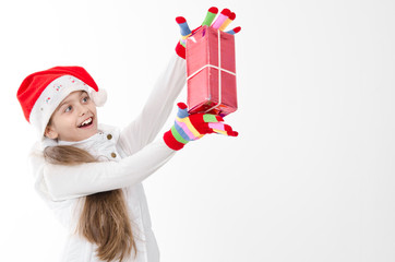 girl in a red hat holding a box with a gift. surprise