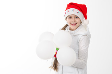 Happy Beautiful Girl in Santa Hat holding white balloons