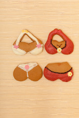 Funny bikini shape gingerbread cakes cookies on bamboo mat