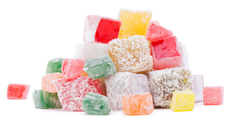 Heap of colorful Turkish delight isolated on white background