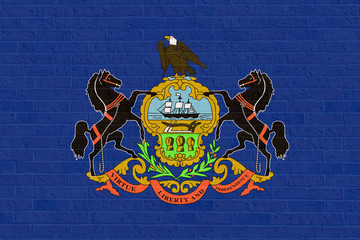 Pennsylvania state flag on brick wall