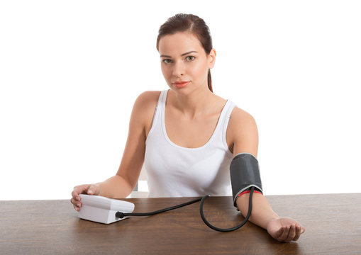 Beautiful Young Woman Taking Blood Pressure Test.