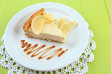 Slice of  lemon cheesecake  and sauce