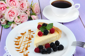 Slice of cheesecake with raspberry and blackberry