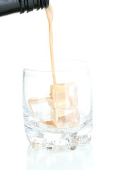 Pouring liquor in glass isolated on white