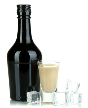 Baileys liqueur in bottle and glass isolated on white