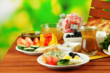 Traditional Turkish breakfast on table on bright background