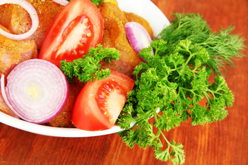 Turkey meat in bowl on wooden table close up