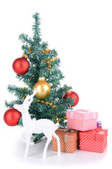 Decorative Christmas tree with gifts isolated on white