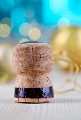 Champagne cork on Christmas lights background