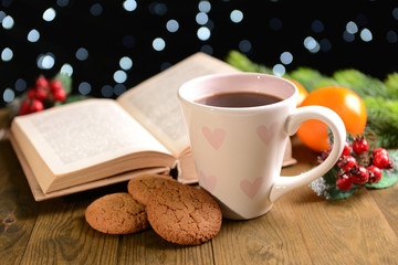 Composition of book with cup of coffee and Christmas