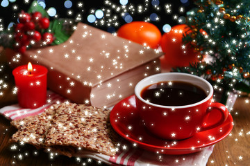 Composition of book with cup of coffee and Christmas