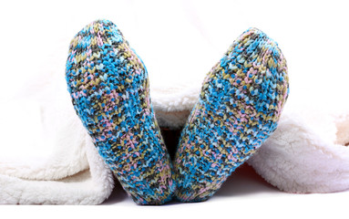 Female legs in colorful socks, isolated on white